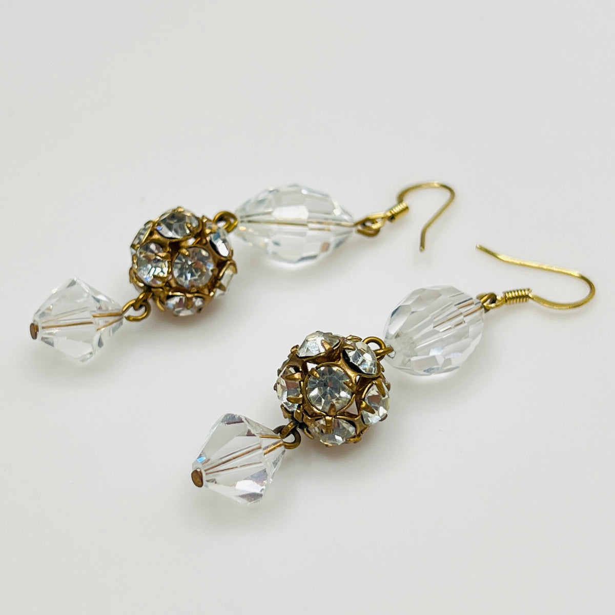 Clear oval crystal, rhinestone ball, and bicone crystal drop earrings