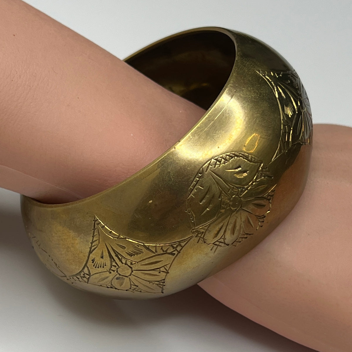 Vintage wide brass bangle bracelet with engraved floral design