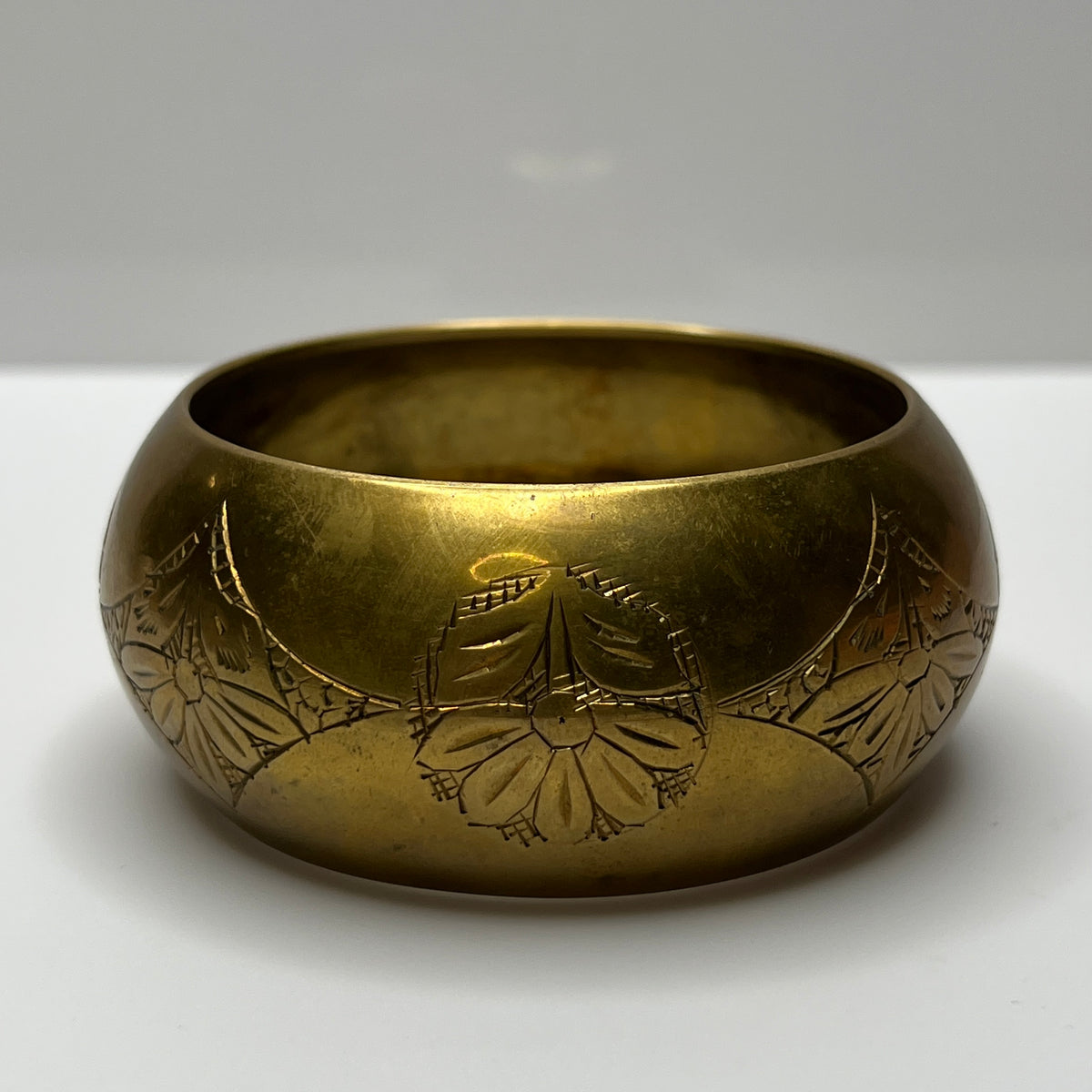 Chunky brass cuff with etched diamond and flower pattern