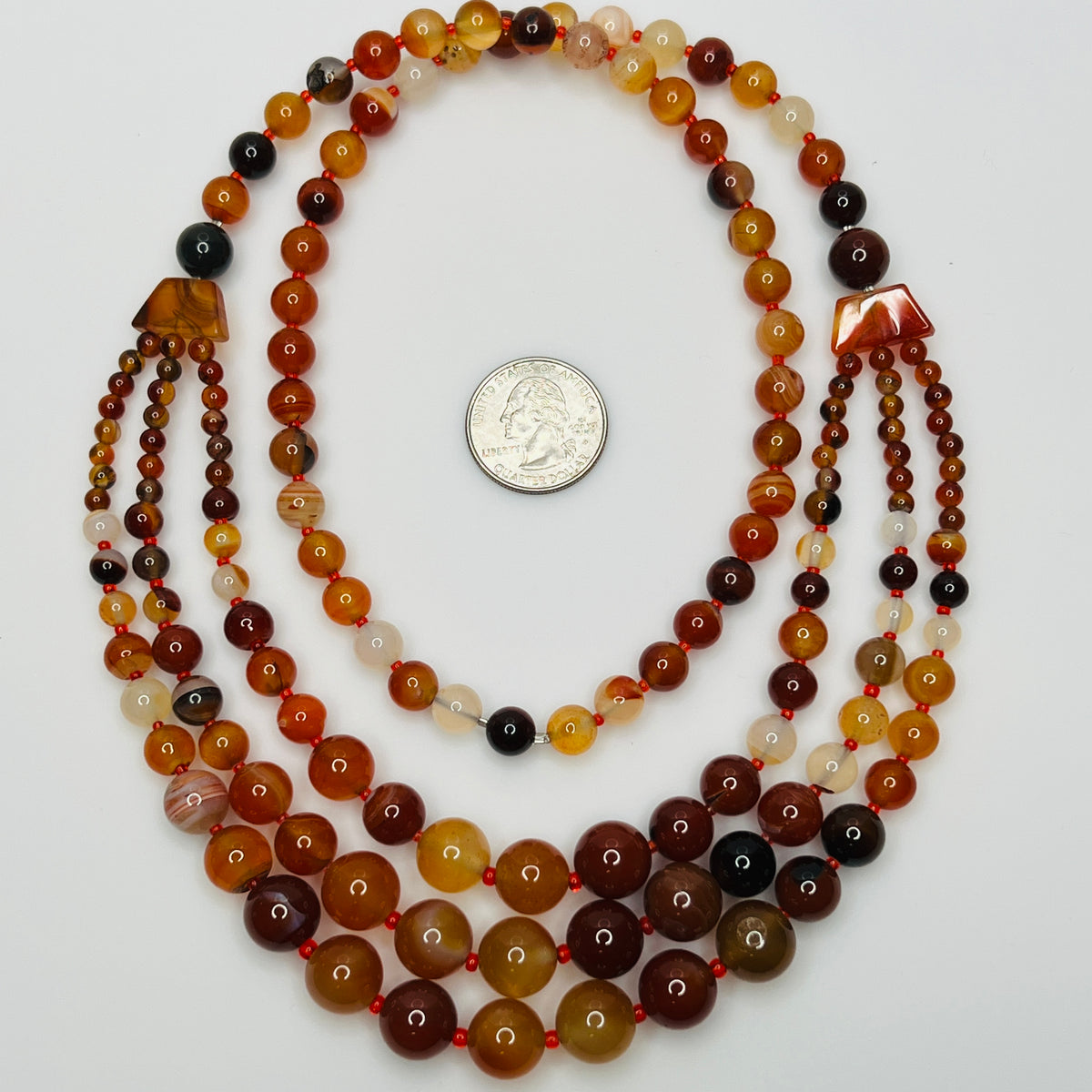 Earthy vintage beaded necklace with layered silhouette and rich color
