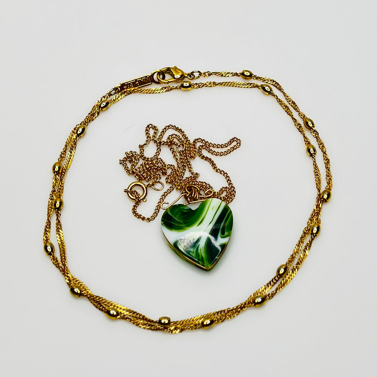 Vintage necklace set with marbled green glass heart pendant and signed Napier gold rope chain
