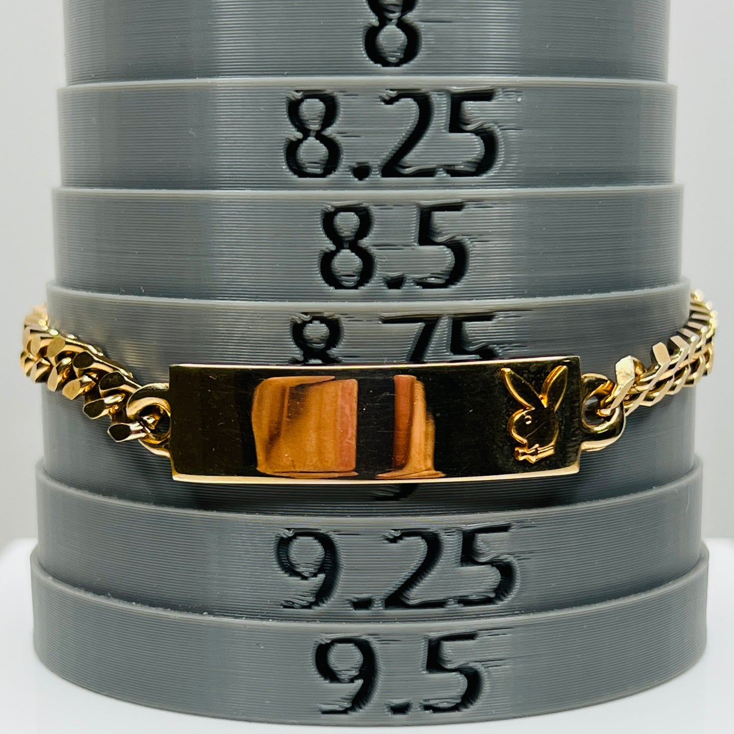 Playboy Bunny ID bracelet on mandrel showing length