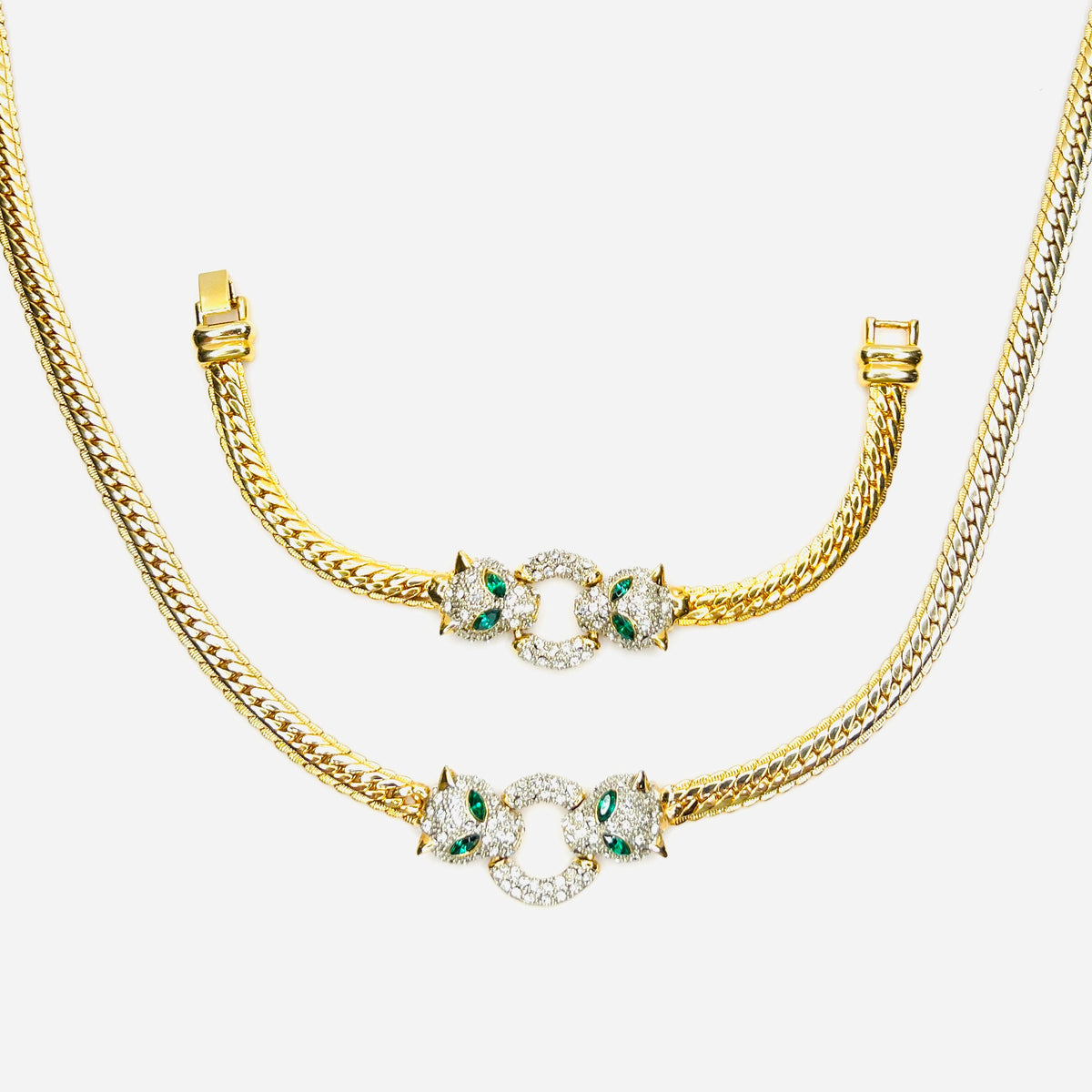 Vintage necklace and bracelet set with rhinestone panther heads and gold herringbone chains
