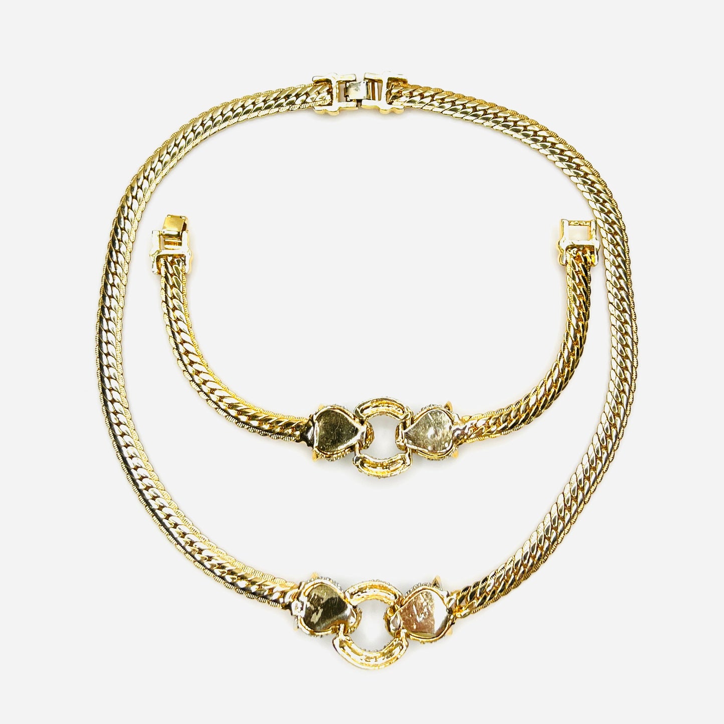 Reverse view of matching vintage panther necklace and bracelet set with fold-over clasps