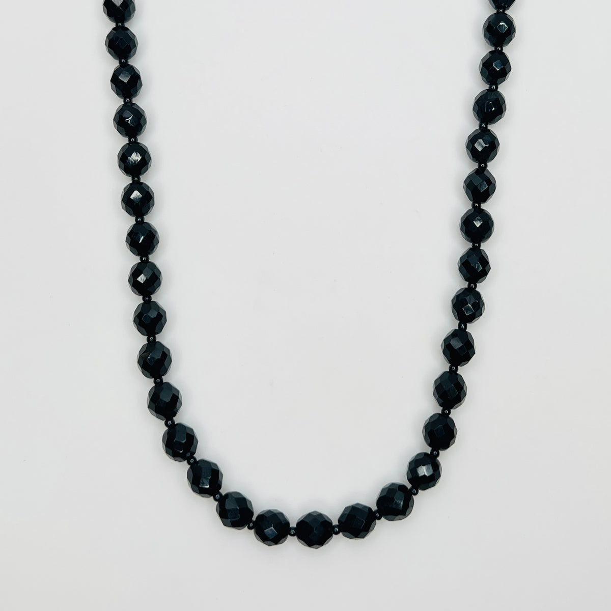 Vintage 1970s black glass bead necklace with gold tone clasp