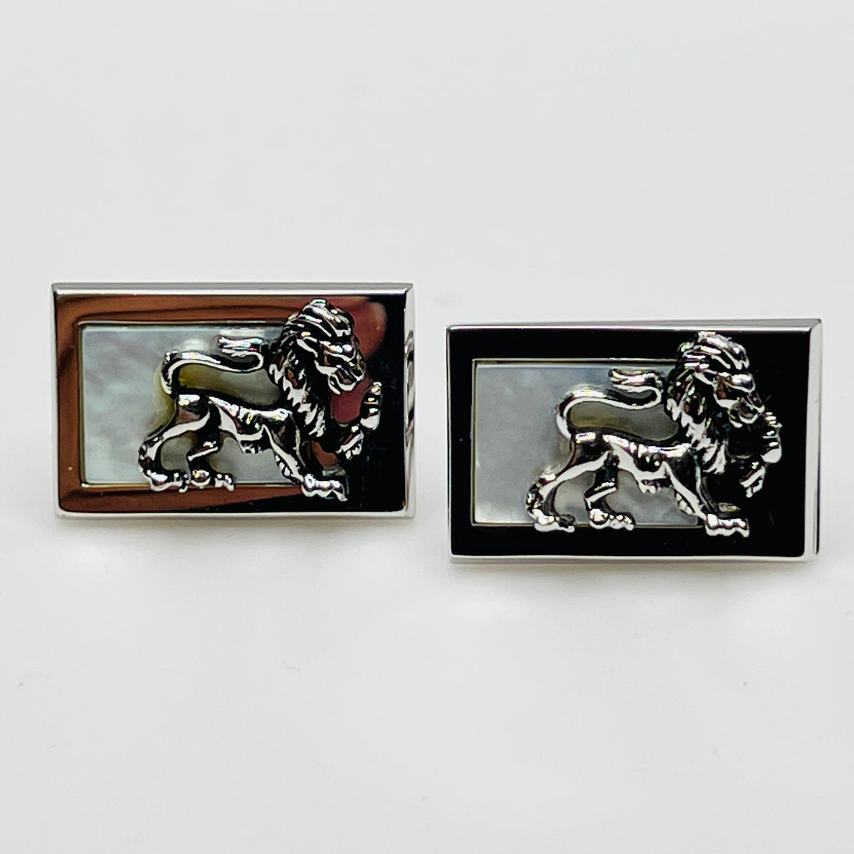 Rectangular silver cufflinks with mother of pearl inlay and raised silver lion motif