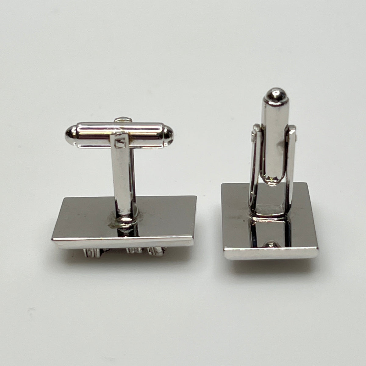 Rectangular silver cufflinks with mother of pearl inlay and raised silver lion motif
