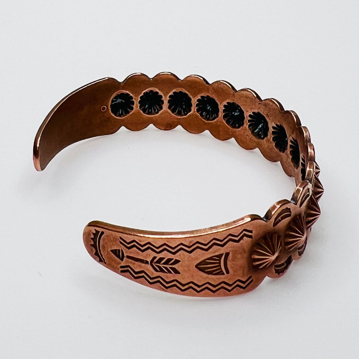 Side view of vintage copper Southwestern cuff bracelet