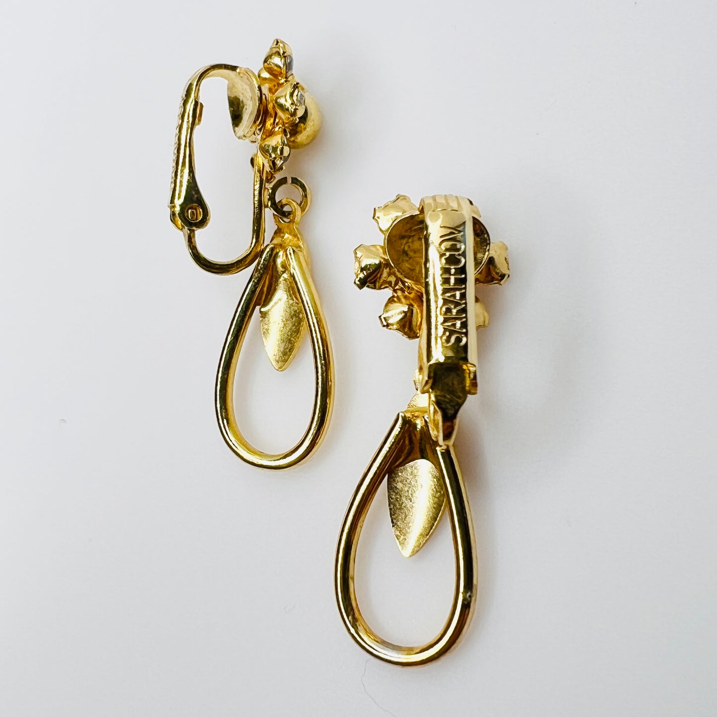 Signed Sarah Coventry clip back detail on vintage rhinestone earrings