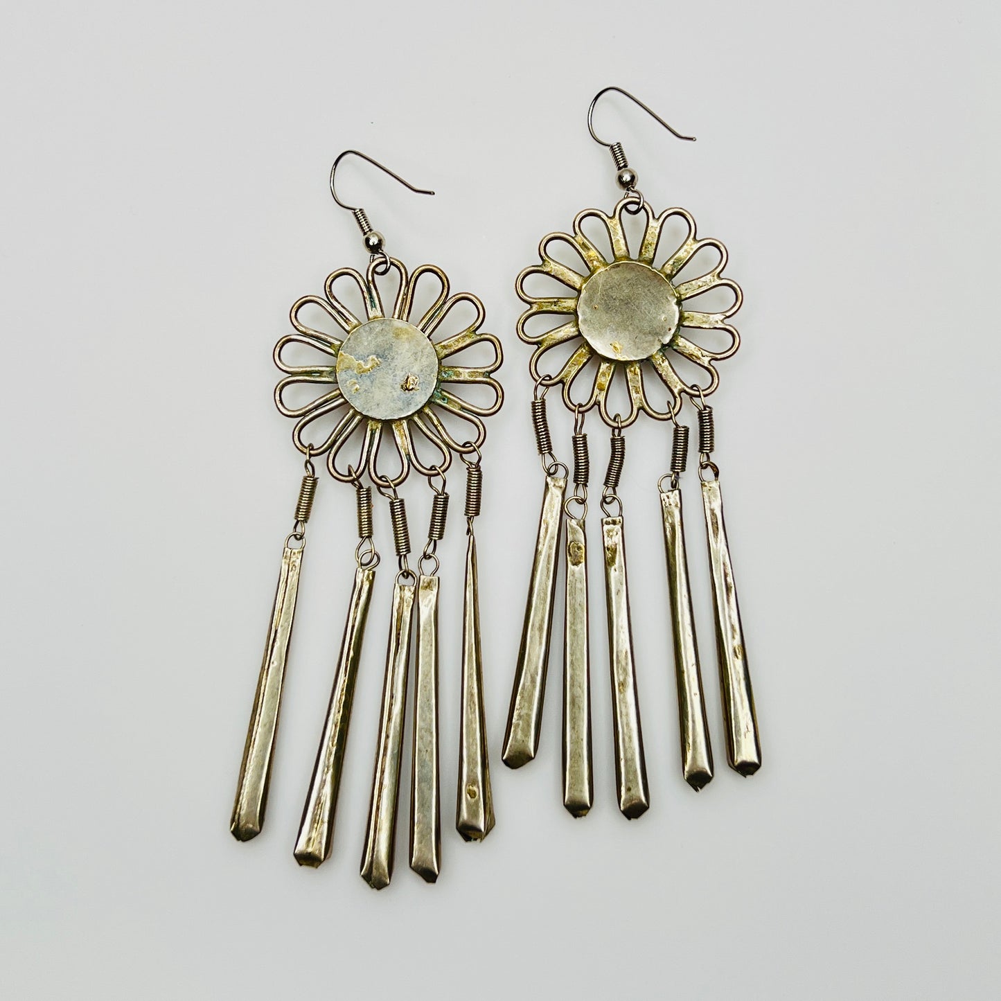 Back view ethnic flower earrings showing construction and patina