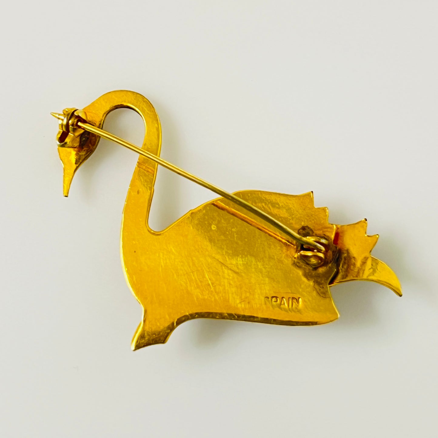 Reverse of Spain Damascene swan brooch showing stamp and clasp