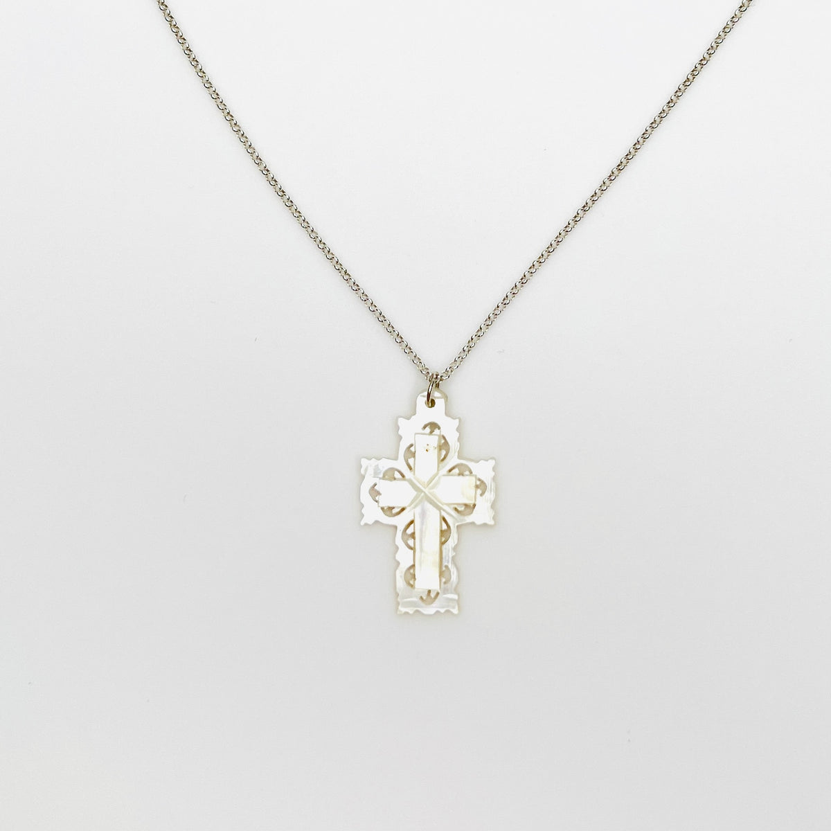Vintage Bethlehem Mother of Pearl filigree cross pendant on sterling silver chain.