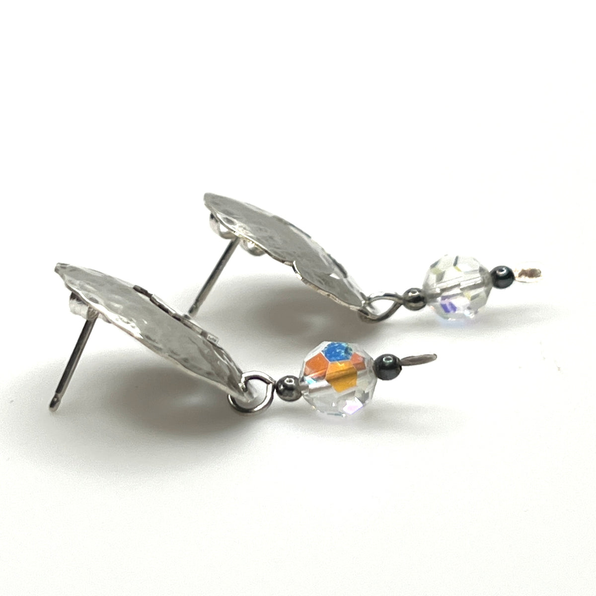 Side view Vintage hammered sterling silver spiral earrings with aurora borealis crystal dangles