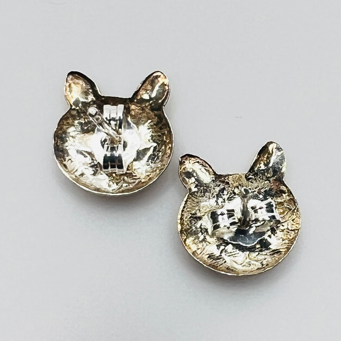 Back of earrings showing butterfly push backs stamped 925