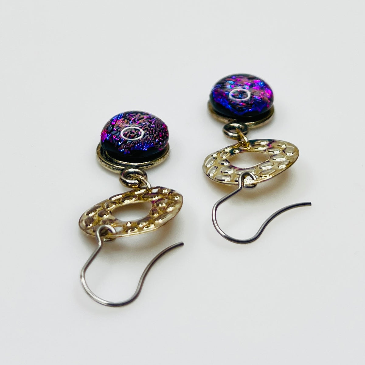 Side view showing hook ear wires and textured silver circles