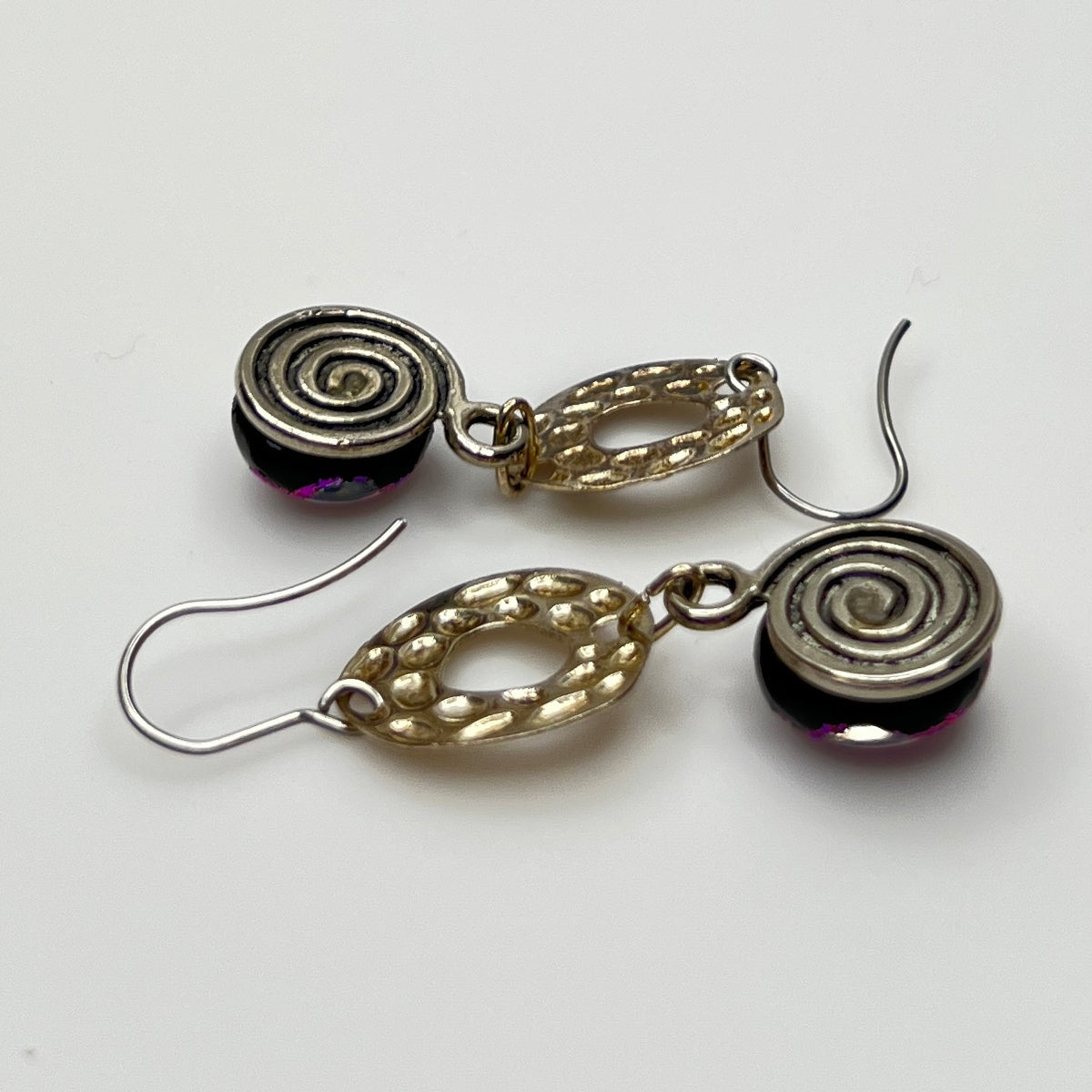 Side view showing hook ear wires and textured silver circles