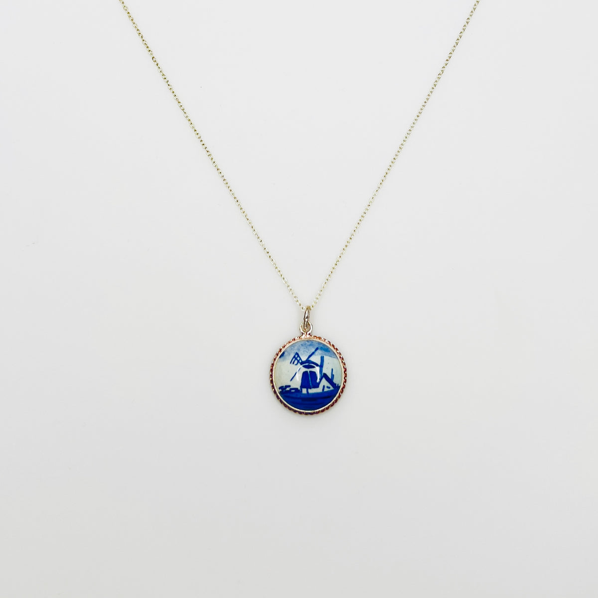 Vintage sterling silver Delft pendant necklace featuring blue Dutch windmill porcelain charm