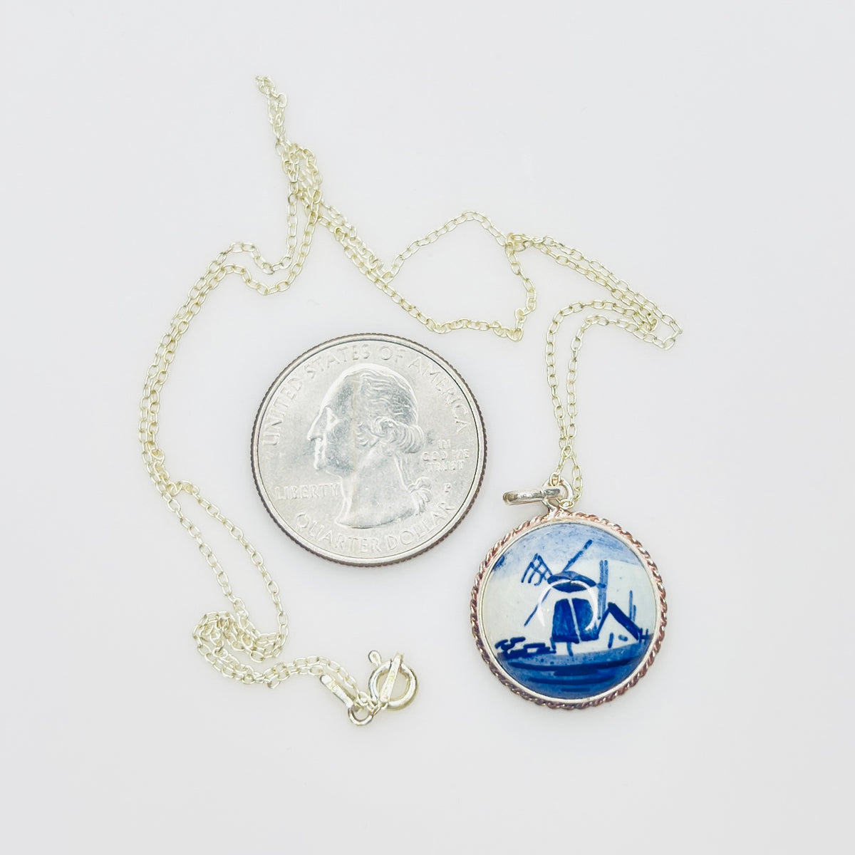 Vintage sterling silver Delft pendant necklace featuring blue Dutch windmill porcelain charm