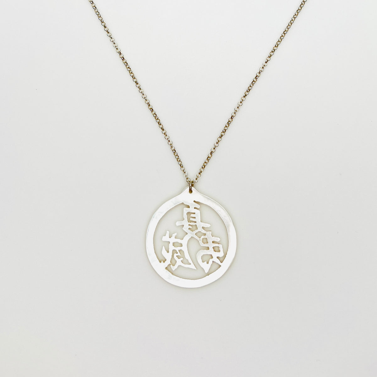 Vintage Mother of Pearl Chinese longevity symbol pendant on sterling silver chain.
