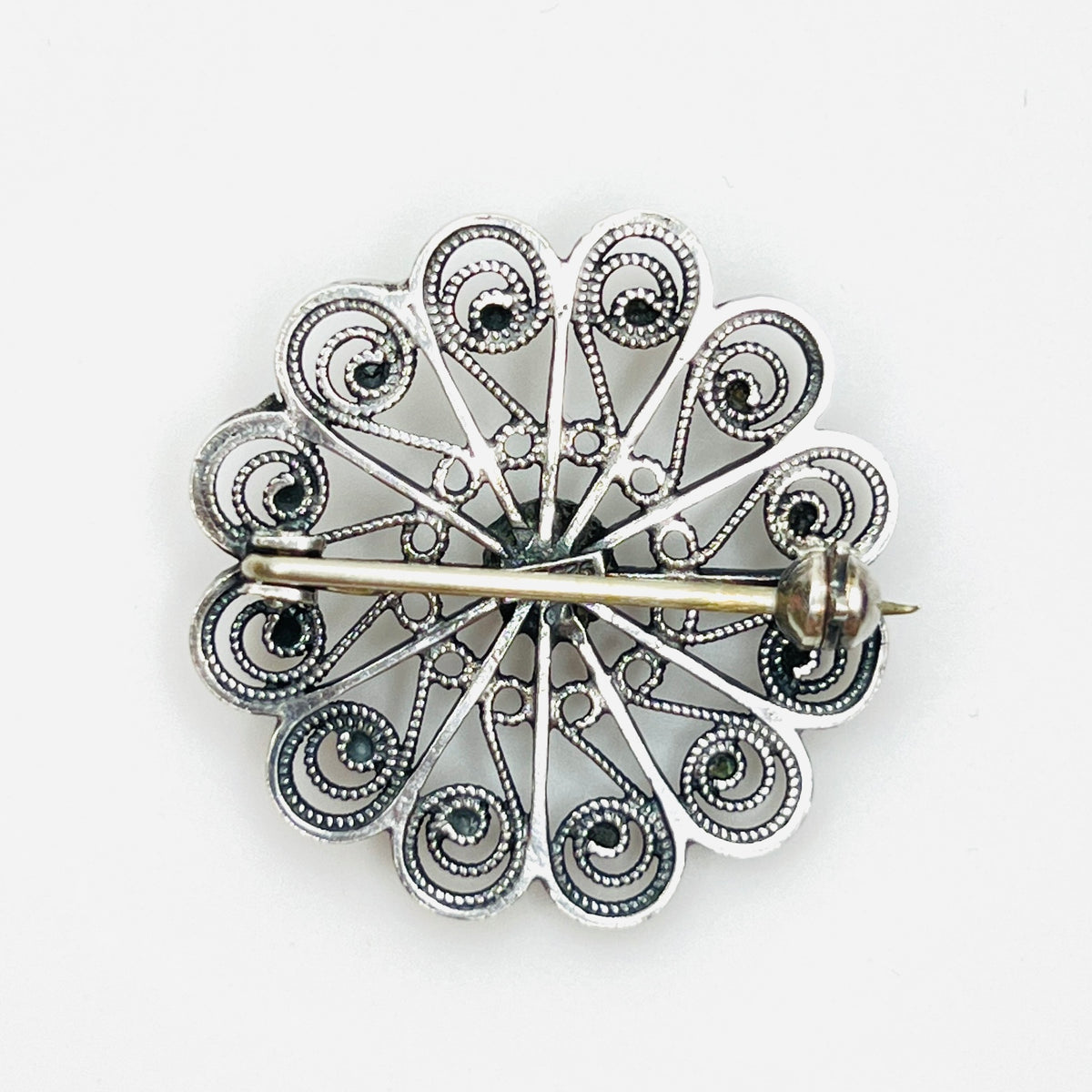 Reverse of sterling silver brooch with secure rollover clasp.