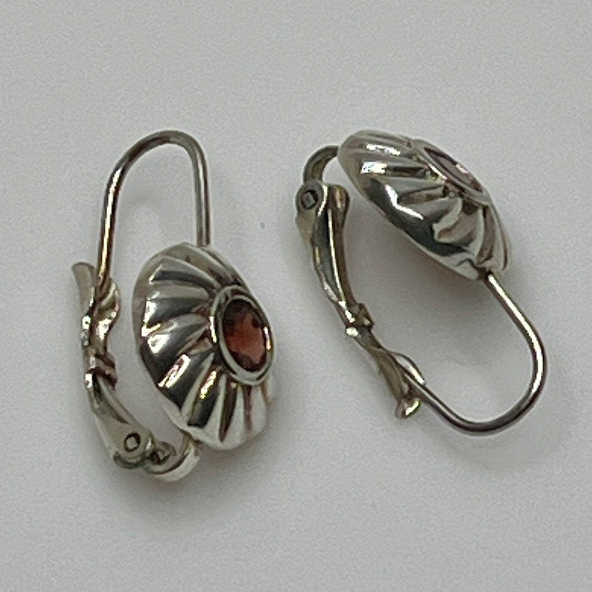 Sterling silver leverback earrings with red spinel cabochons in swirl design
