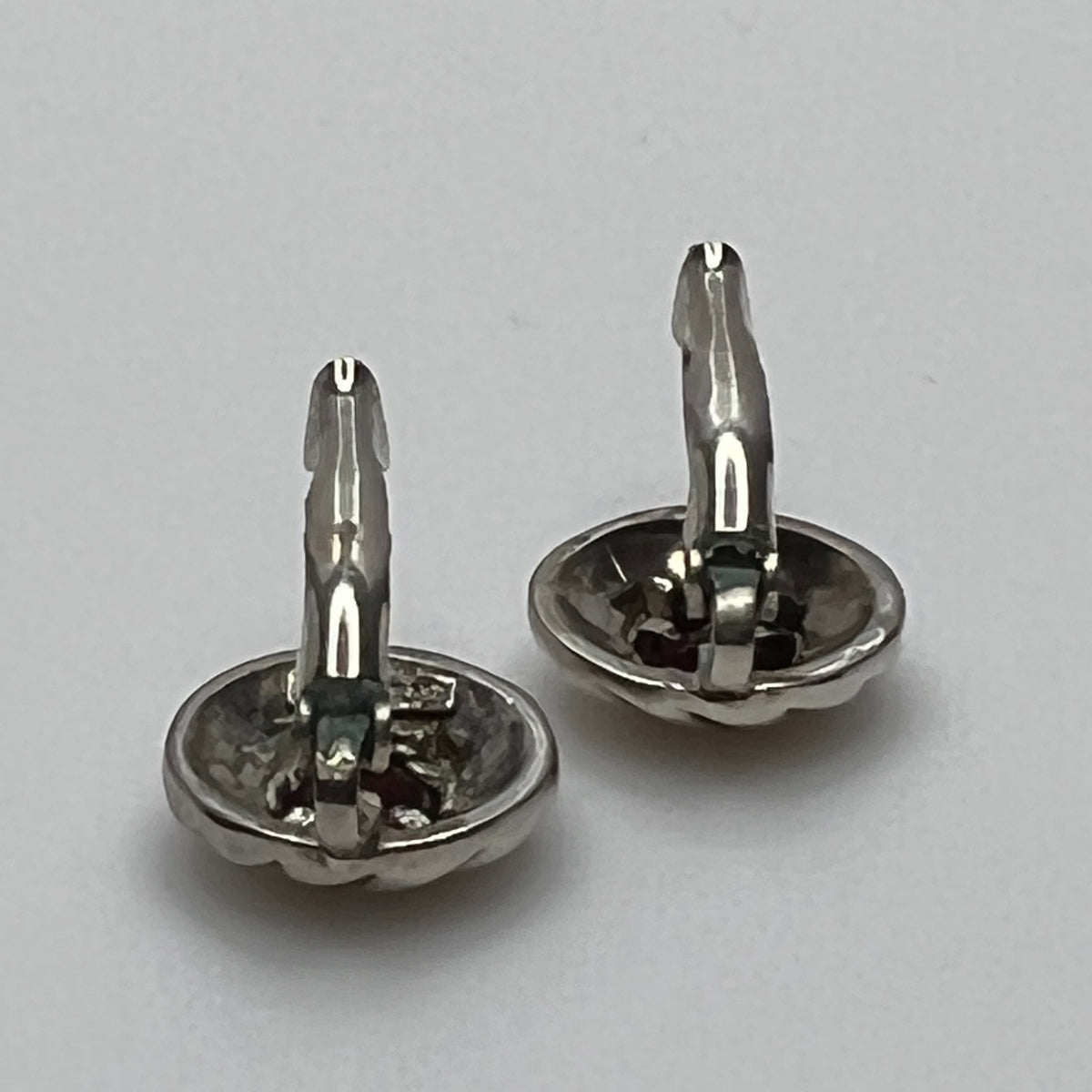 Sterling silver leverback earrings with red spinel cabochons in swirl design