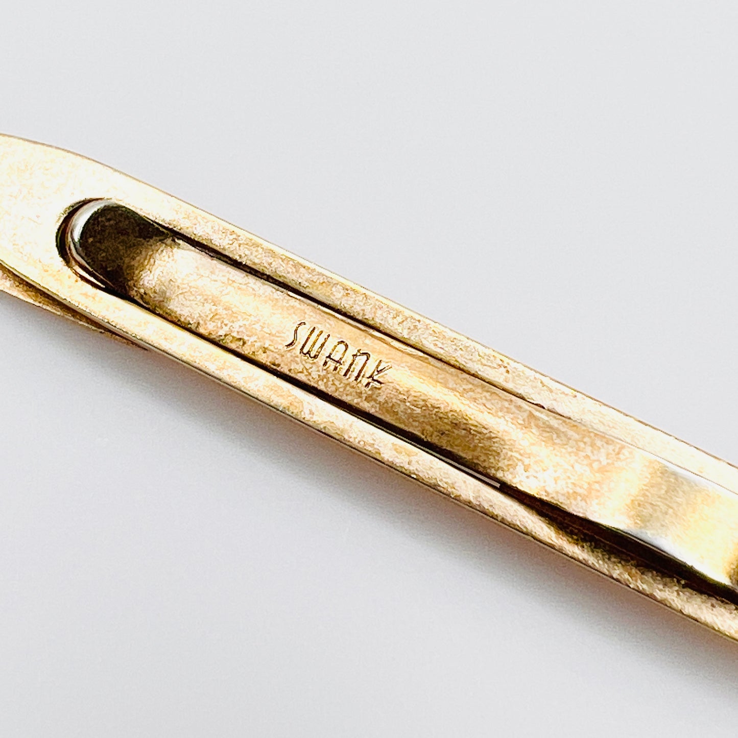 Signed Swank vintage tie bar close-up