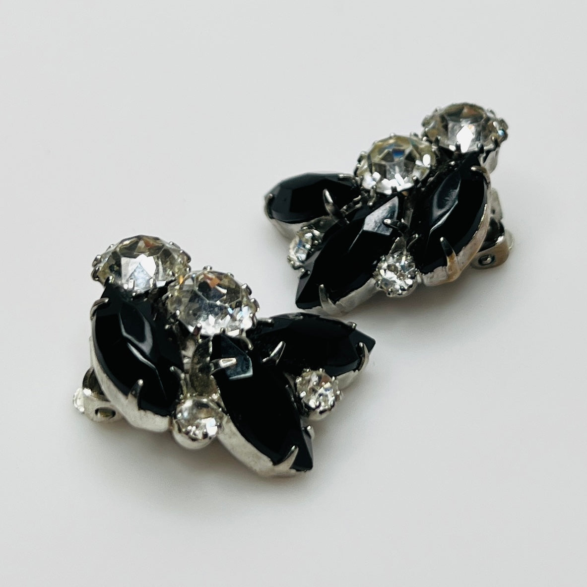 1950s Weiss earrings with leaf-shaped rhinestone cluster