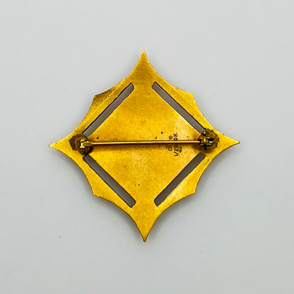 Close-up of back showing “cTo 1/20 10K” hallmark on textured gold surface