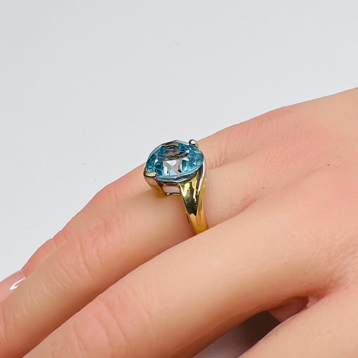 Vintage 10K gold ring with heart-shaped aquamarine gemstone on hand