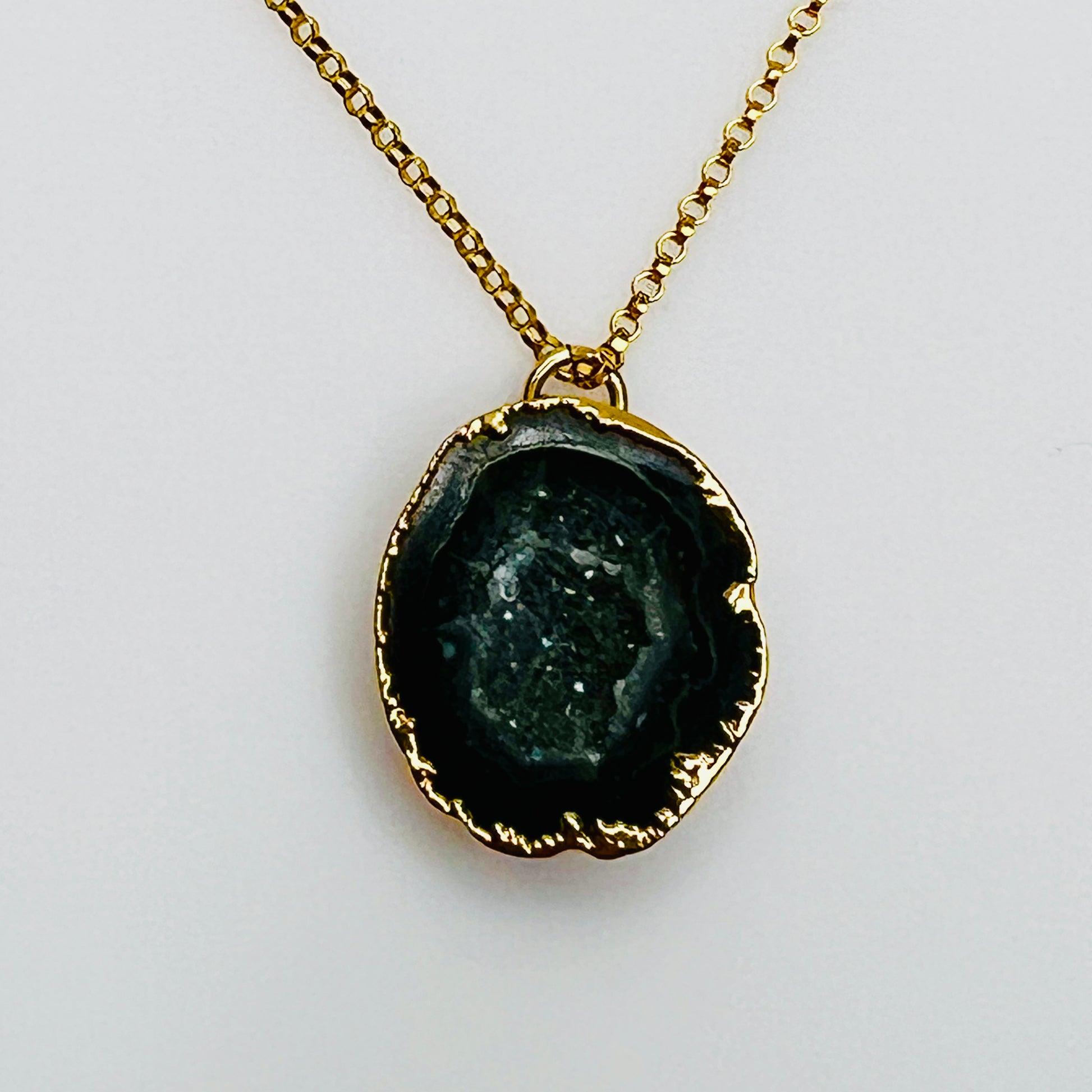 Gold filled necklace with black agate geode slice pendant