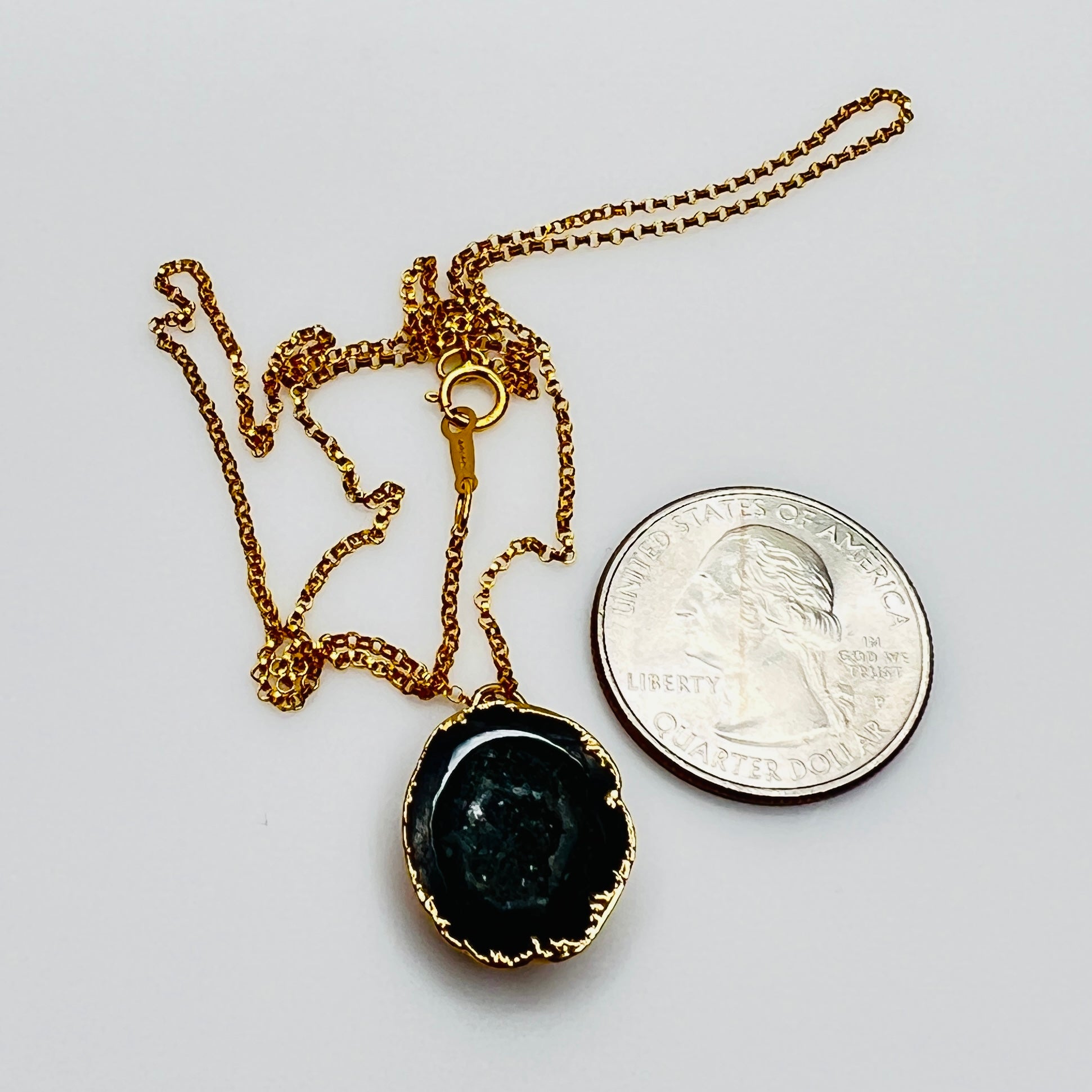 Gold filled necklace with black agate geode slice pendant