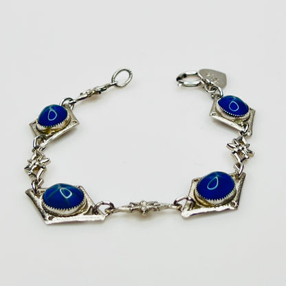 Overhead view of Sentiment bracelet showing blue cabochons and clasp