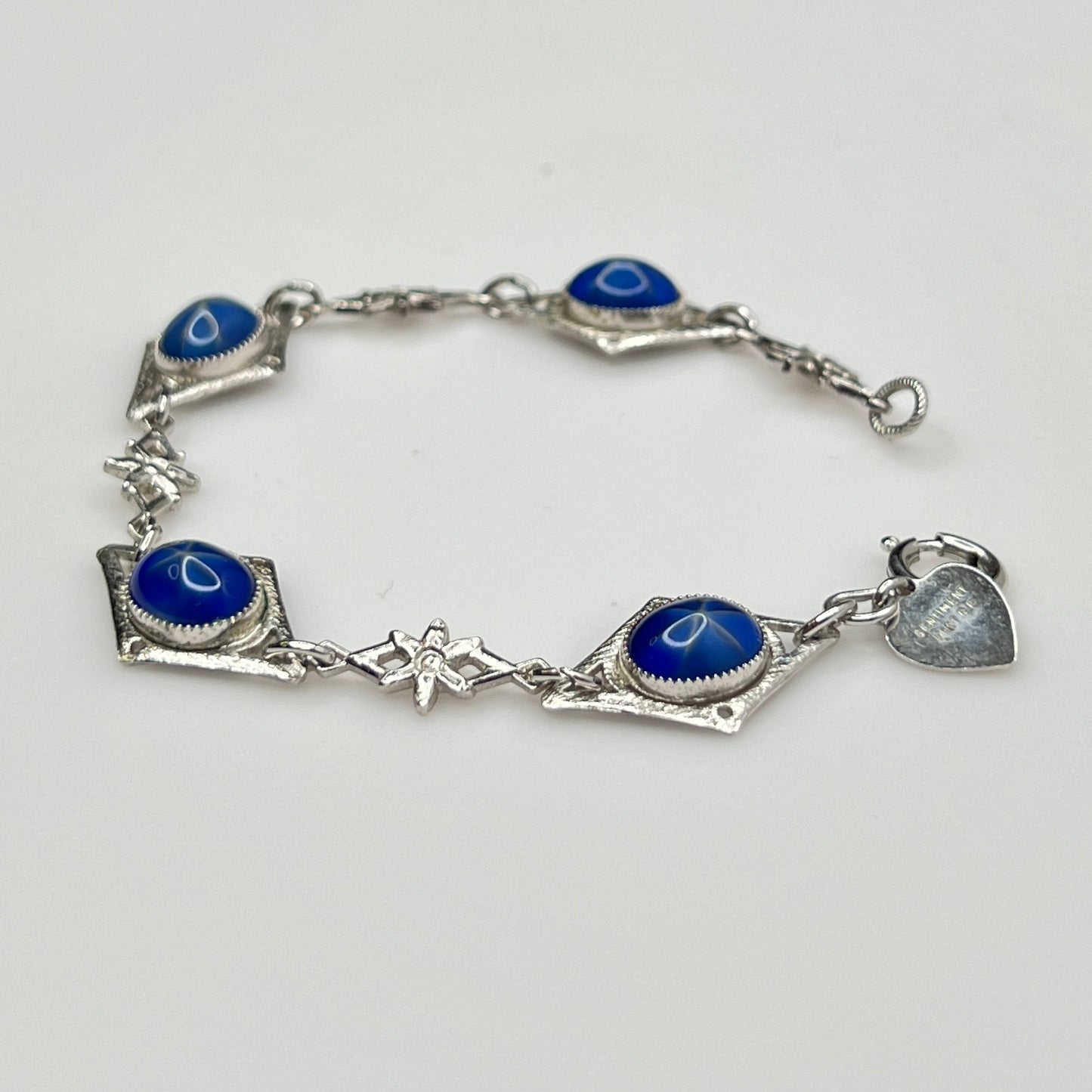 Overhead view of Sentiment bracelet showing blue cabochons and clasp