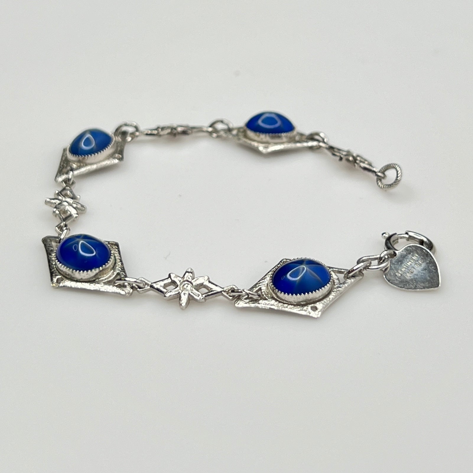 Overhead view of Sentiment bracelet showing blue cabochons and clasp