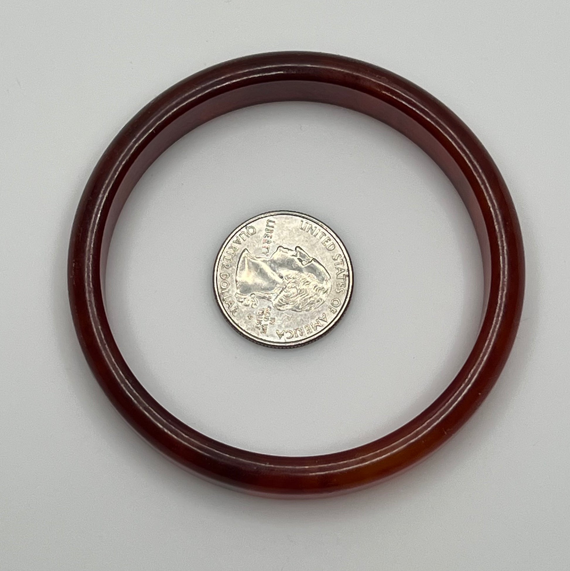 Rounded ½" wide Bakelite bracelet with warm amber swirls