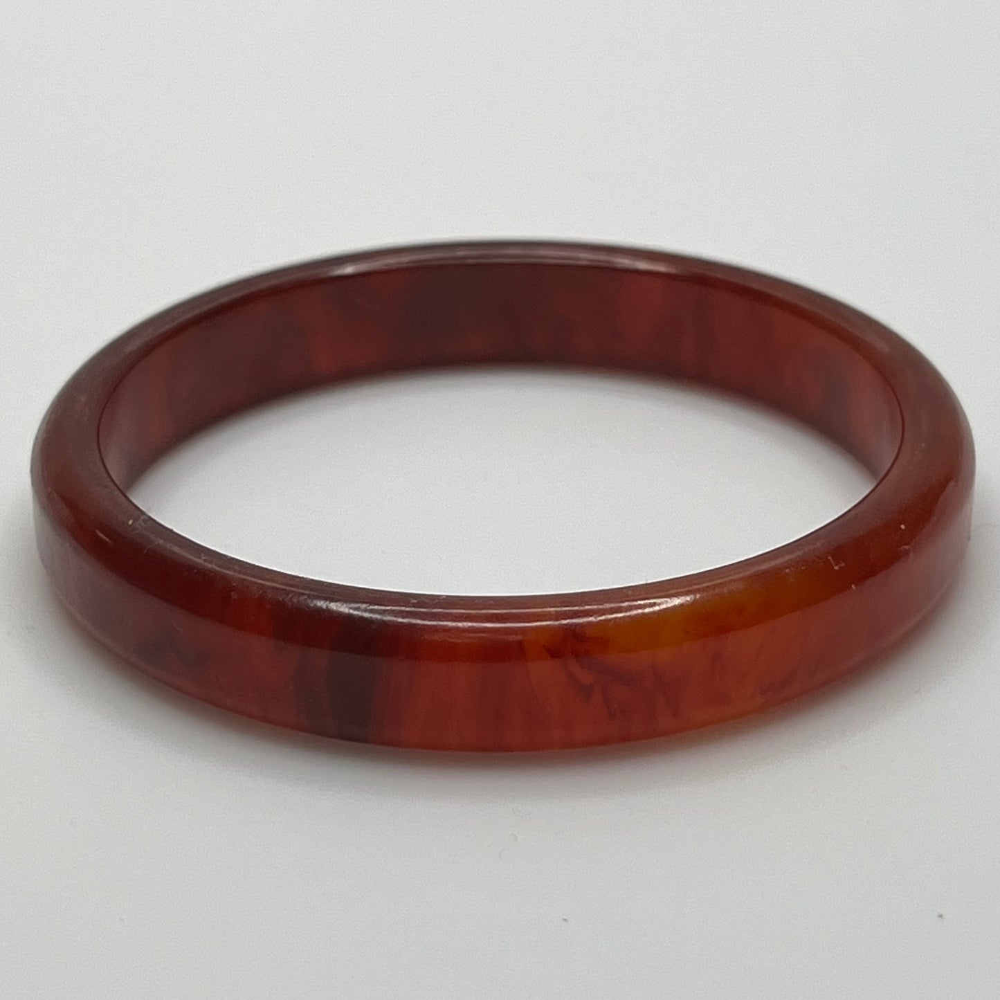 Rounded ½" wide Bakelite bracelet with warm amber swirls