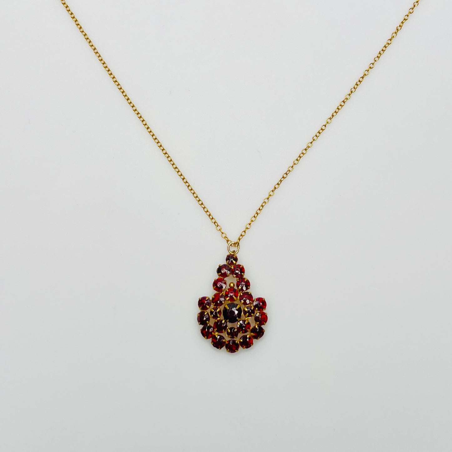 Close up prong set ruby red Czech glass cluster pendant