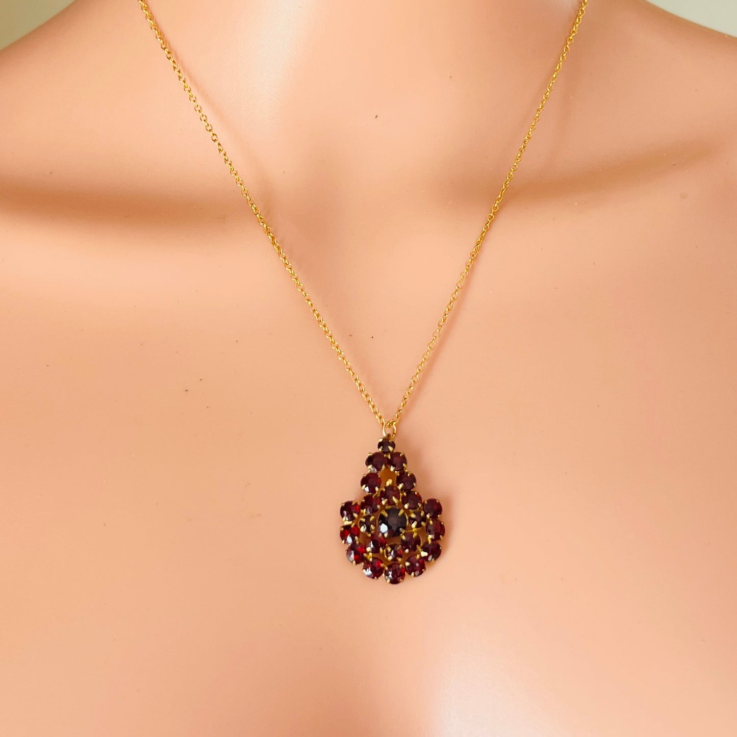 Vintage red Czech glass pendant worn on mannequin Art Deco style