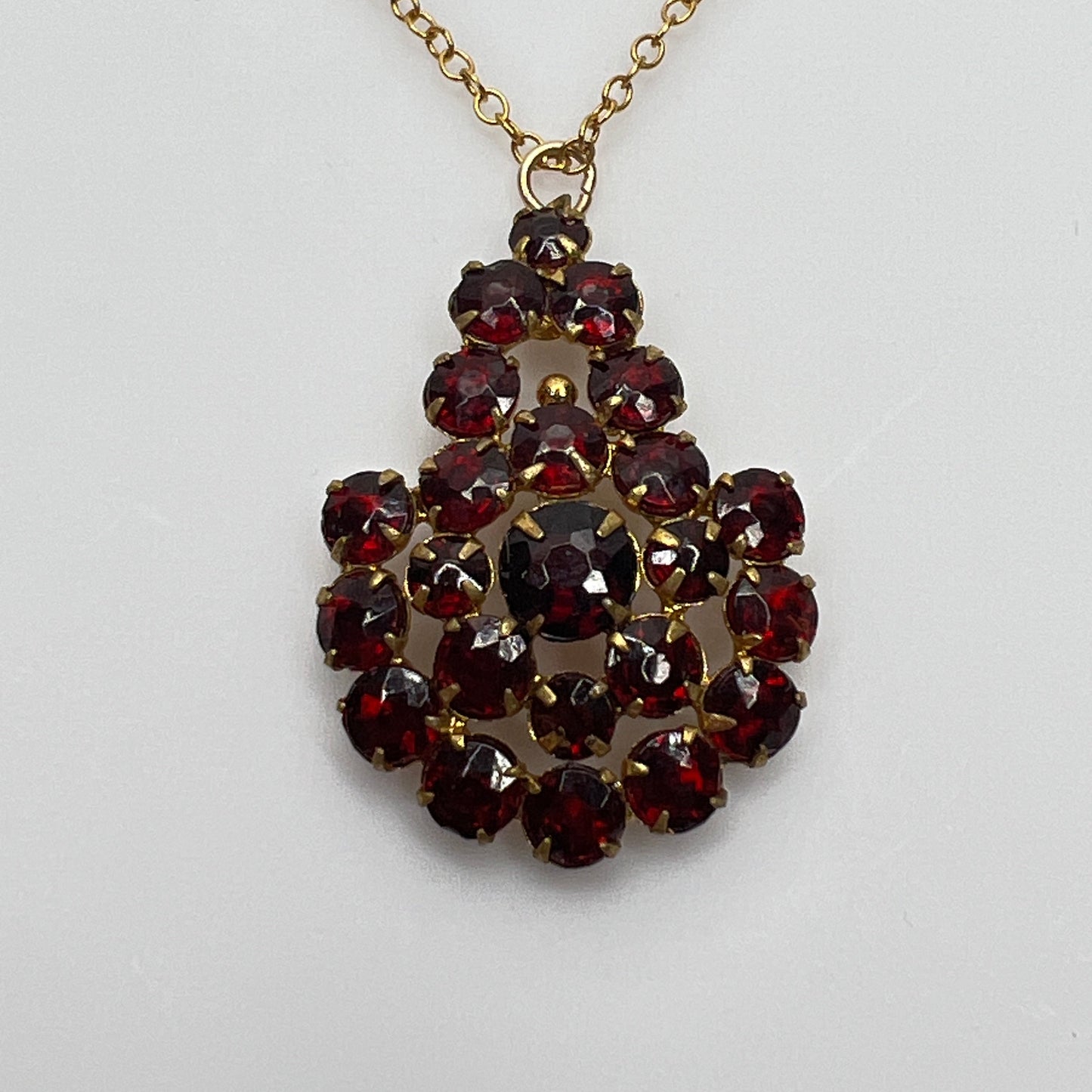 Close up prong set ruby red Czech glass cluster pendant