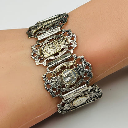 Filigree panel bracelet worn showing French crest and Eiffel Tower