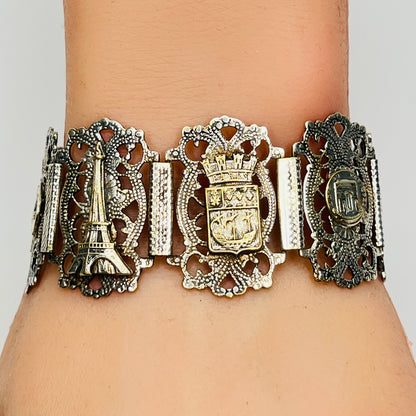 Filigree panel bracelet worn showing French crest and Eiffel Tower
