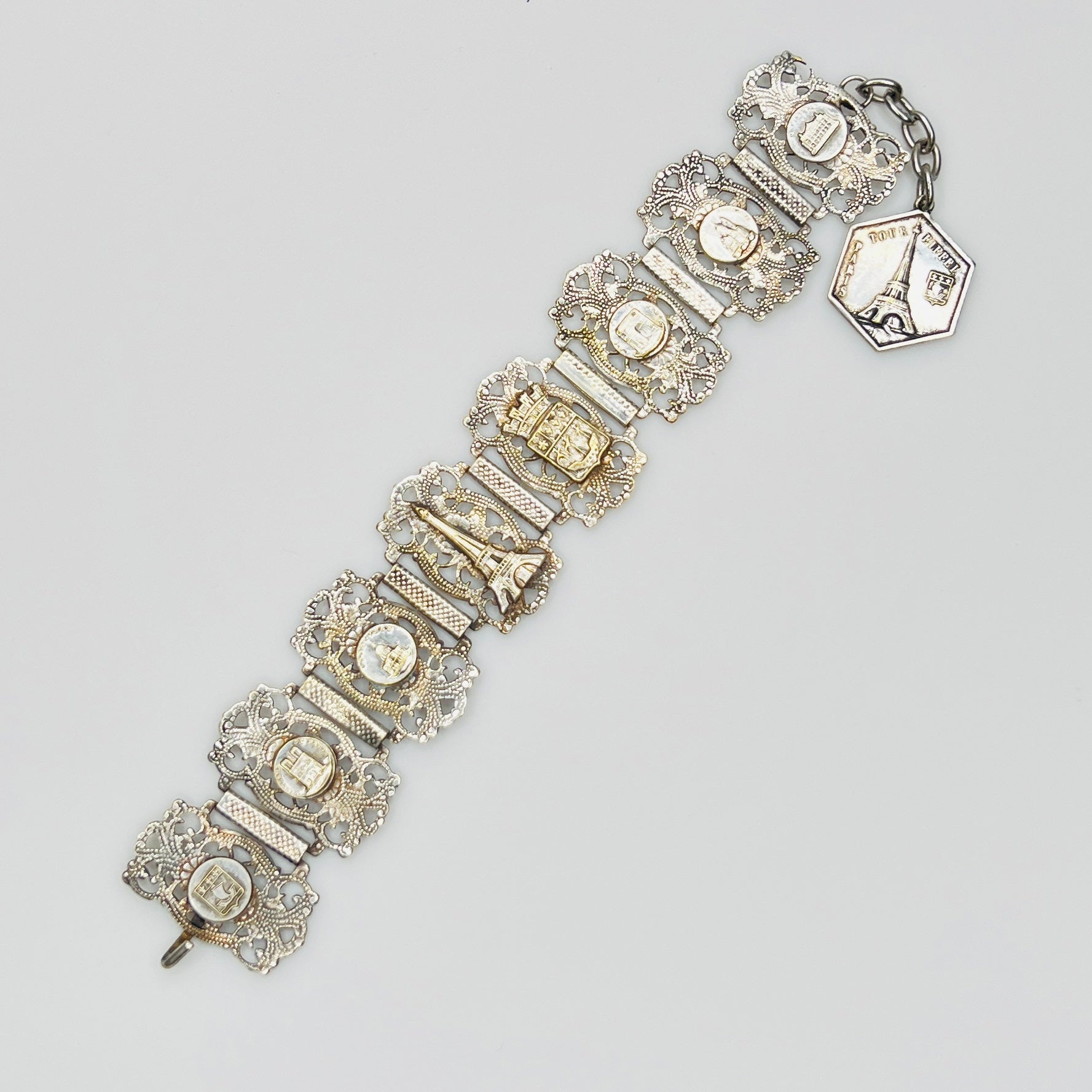 Full view of 1930s Paris souvenir bracelet with charm