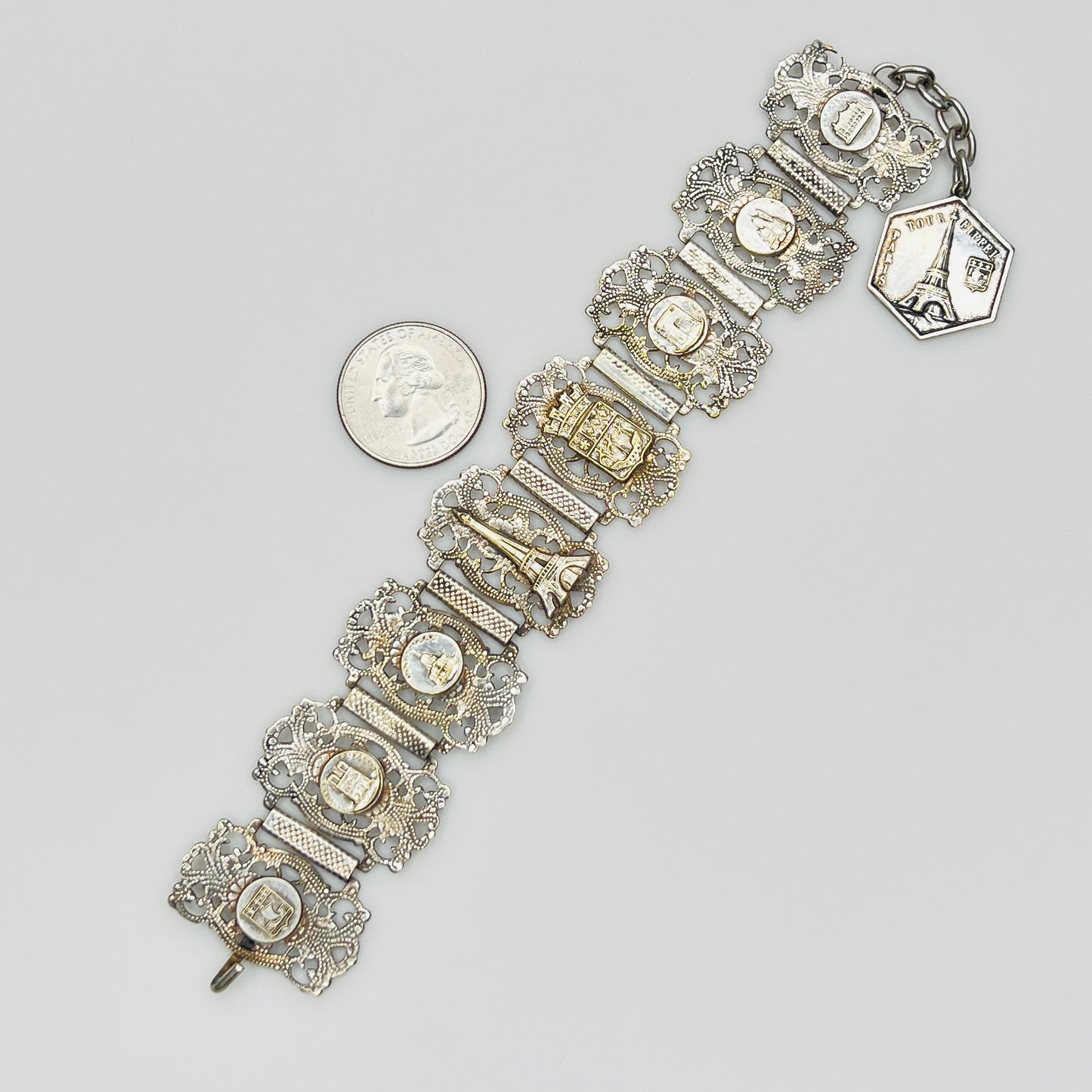 Full view of 1930s Paris souvenir bracelet with charm