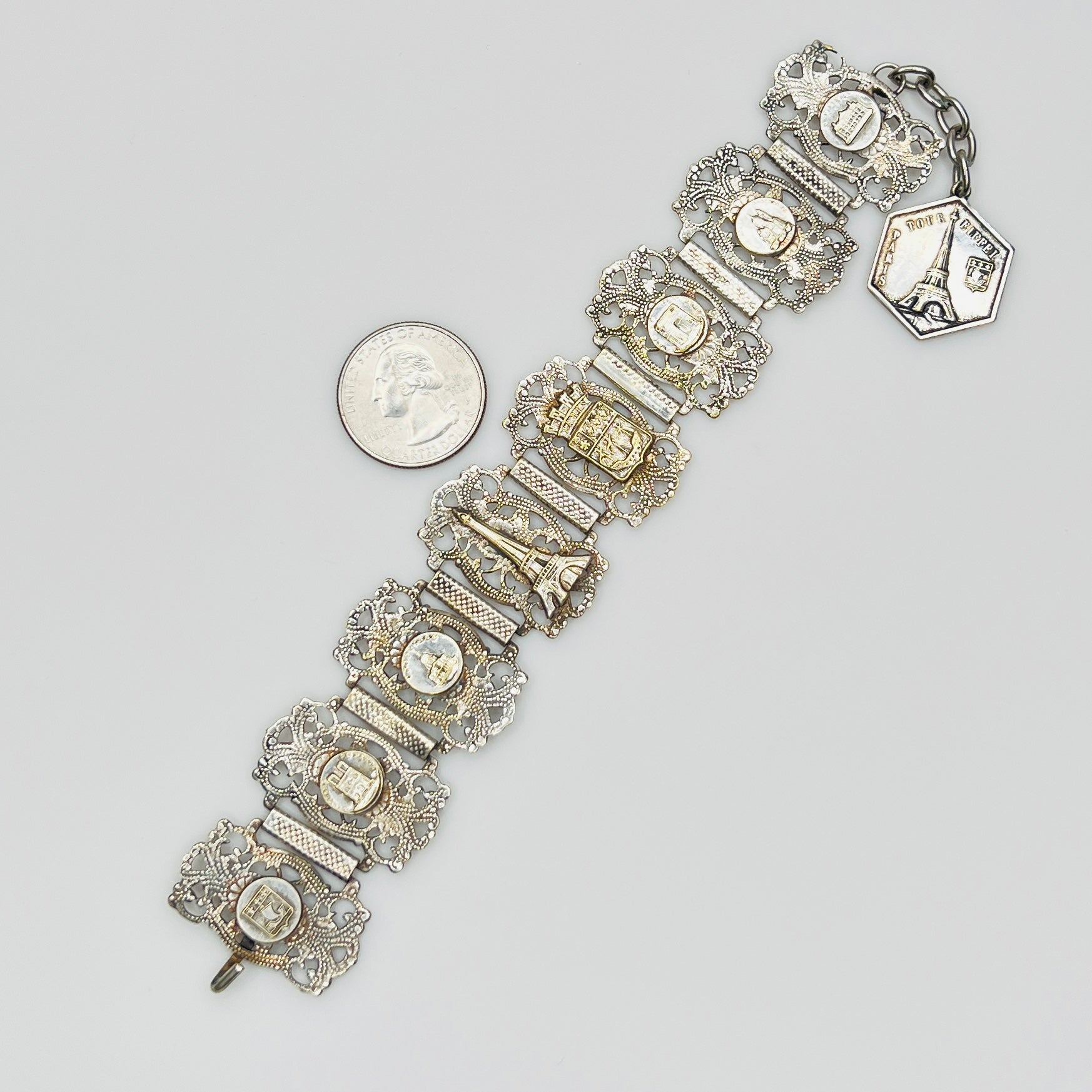 Full view of 1930s Paris souvenir bracelet with charm