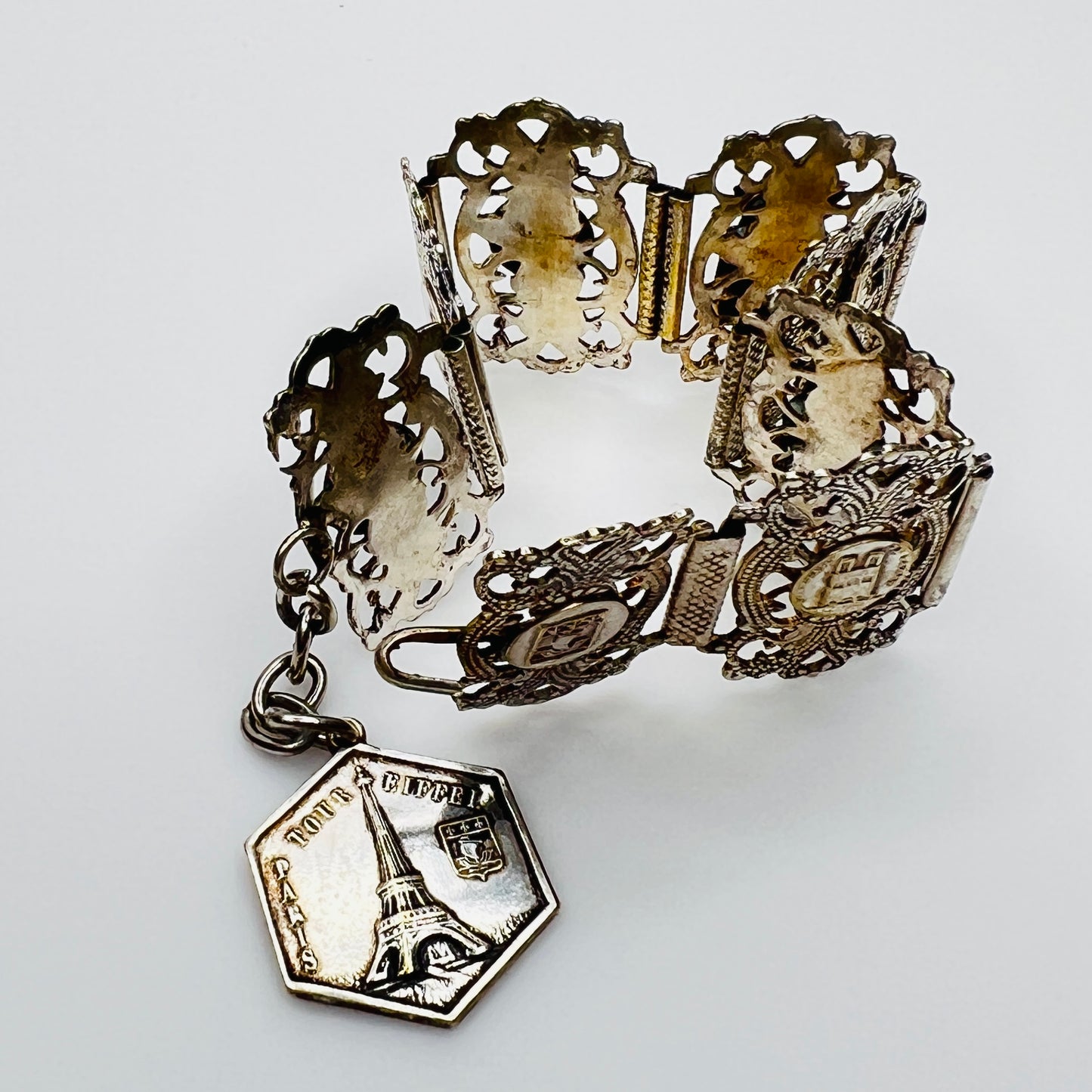 Full view of 1930s Paris souvenir bracelet with charm