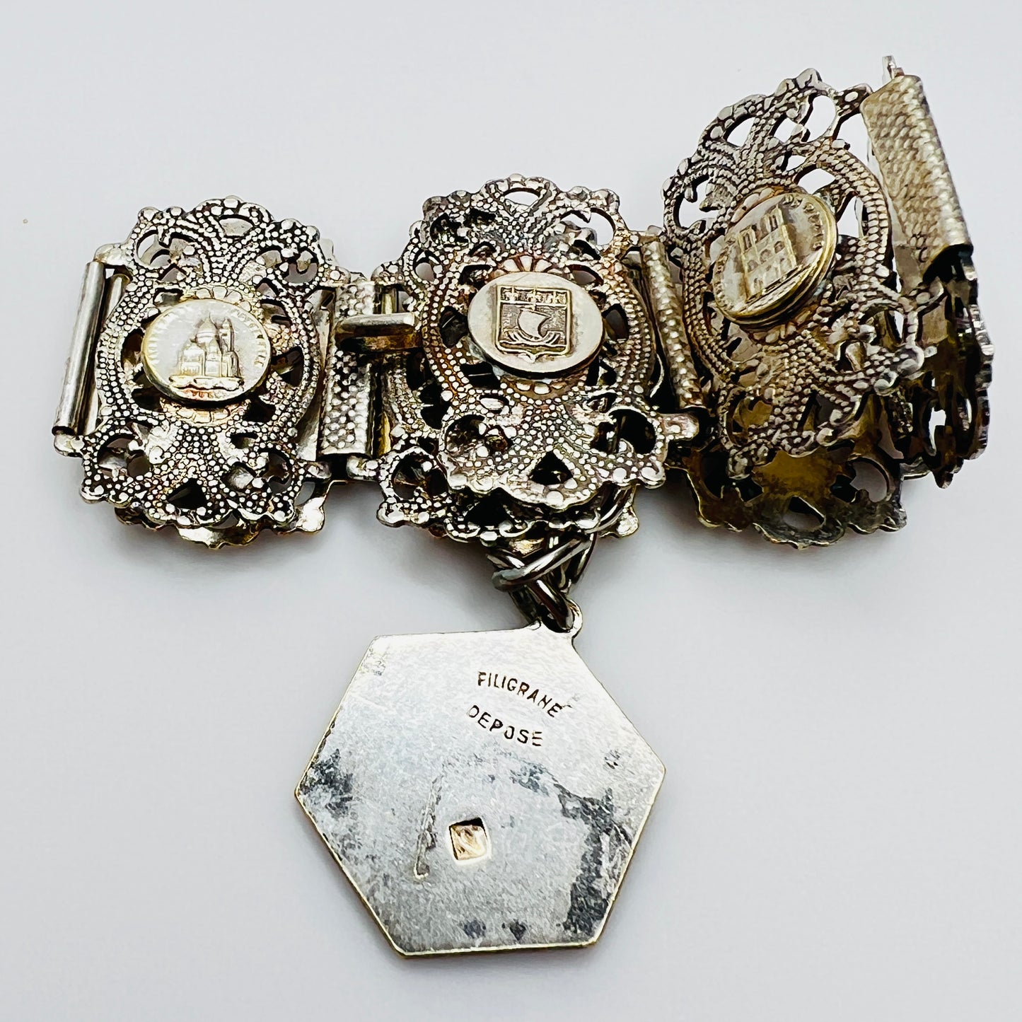 Full view of 1930s Paris souvenir bracelet with charm