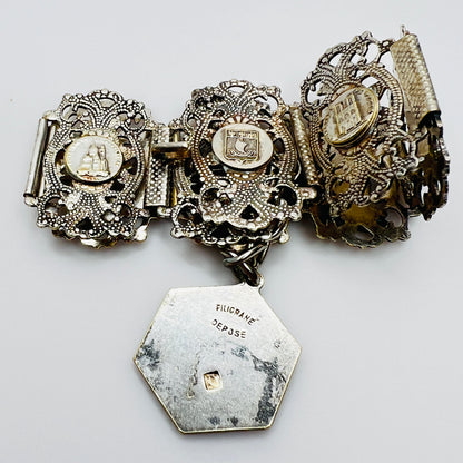 Full view of 1930s Paris souvenir bracelet with charm