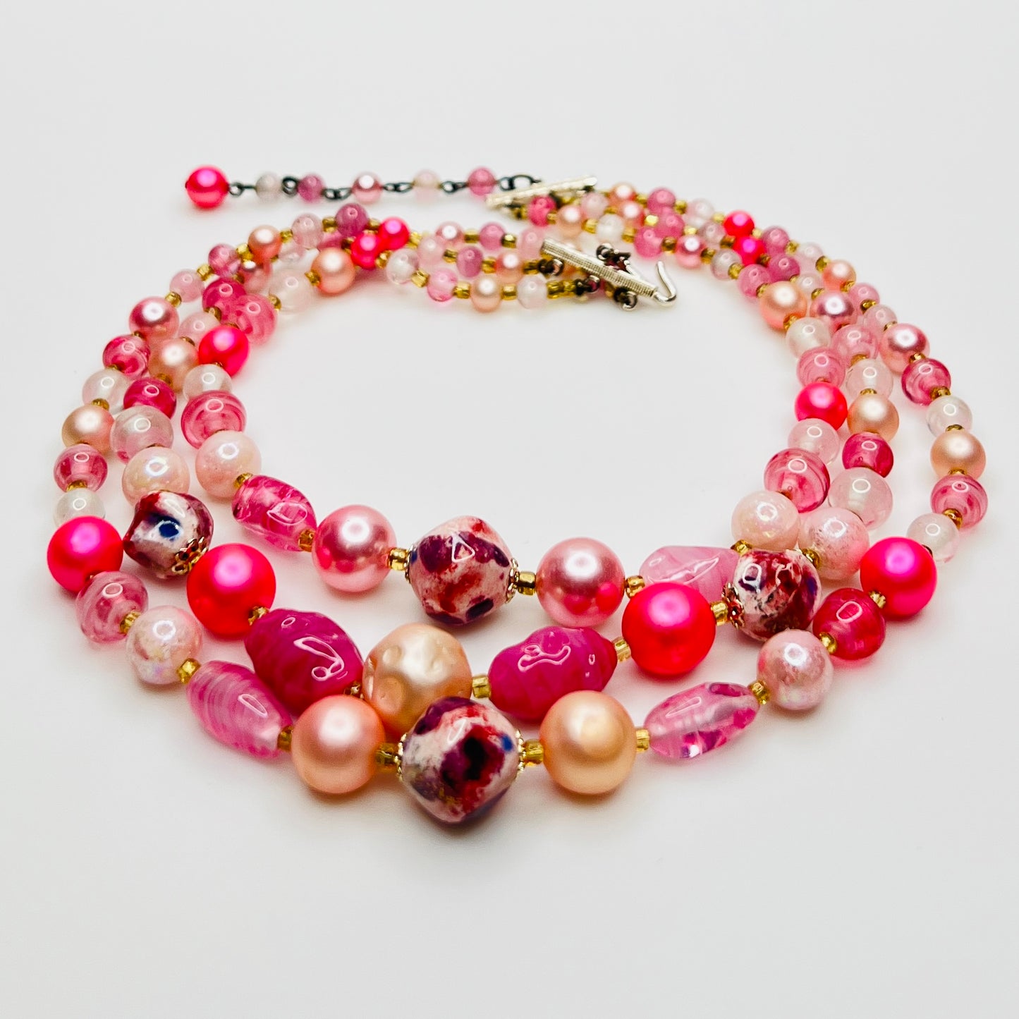Mixed pink glass and pearl beads multi strand necklace