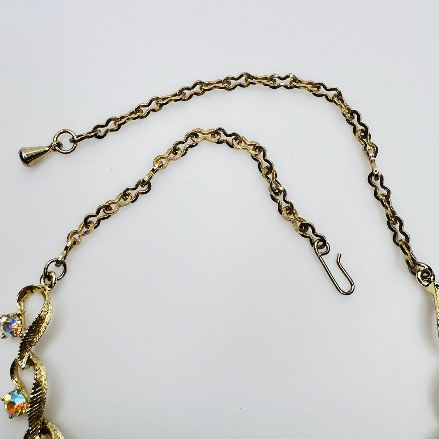 Flat lay of vintage aurora borealis choker necklace hook clasp